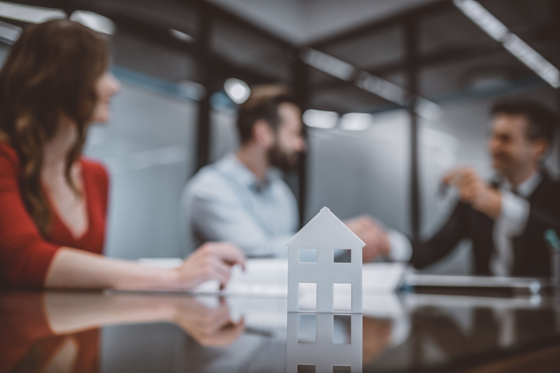 Couple buying real estate at the companys office